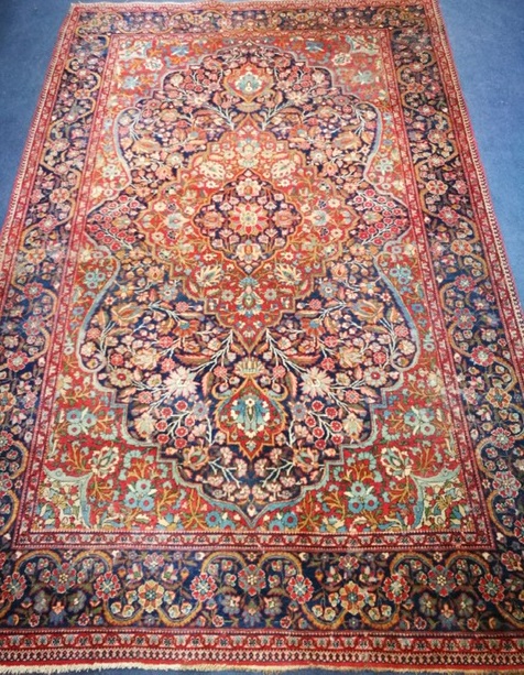 An Isphaphan blue ground medallion rug 210 x 131cm
